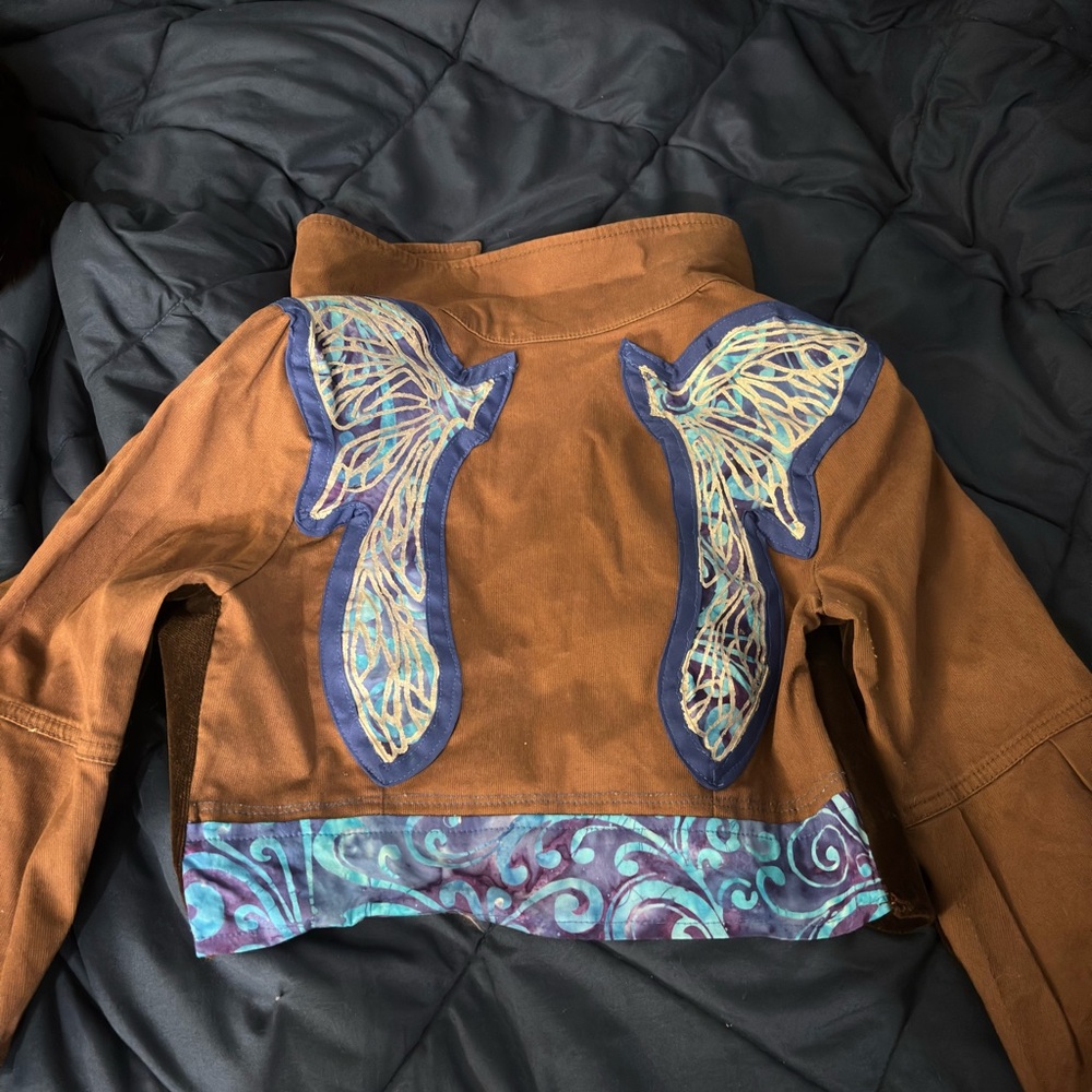 Handmade brown jacket with embroidered wing accents